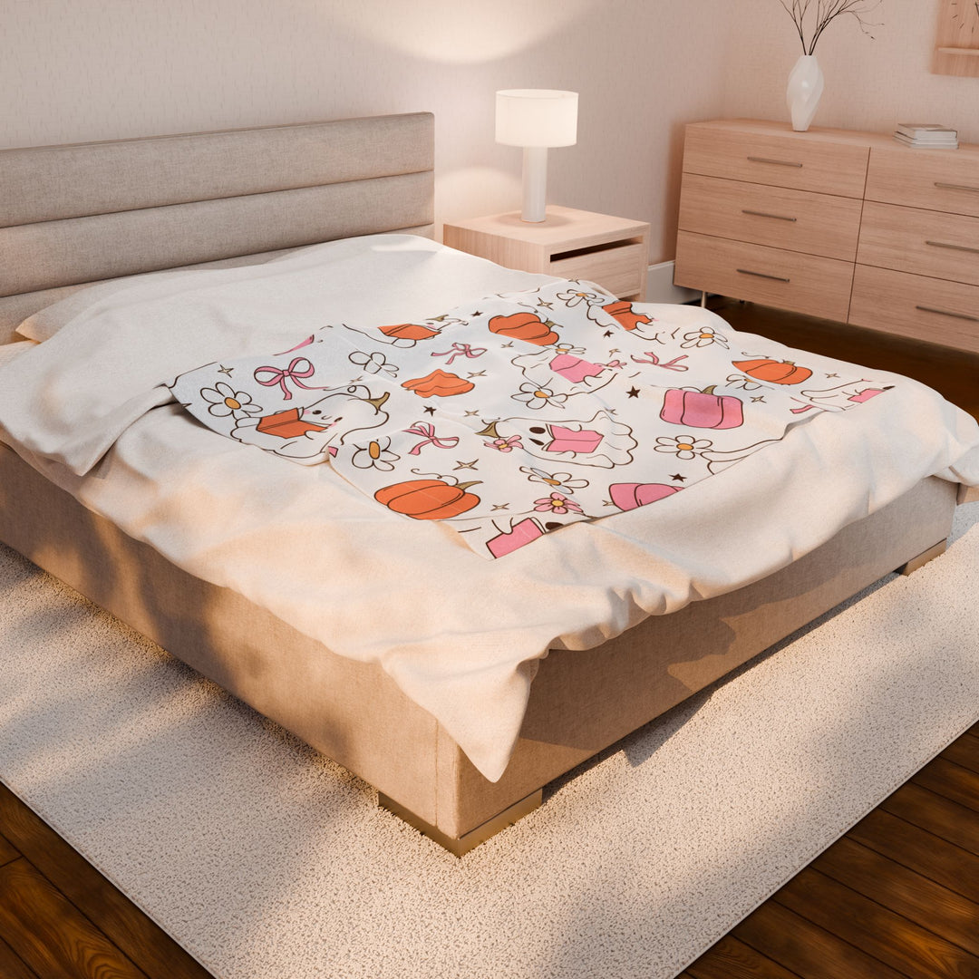 Bed with cartoon-themed blanket in a bedroom setting