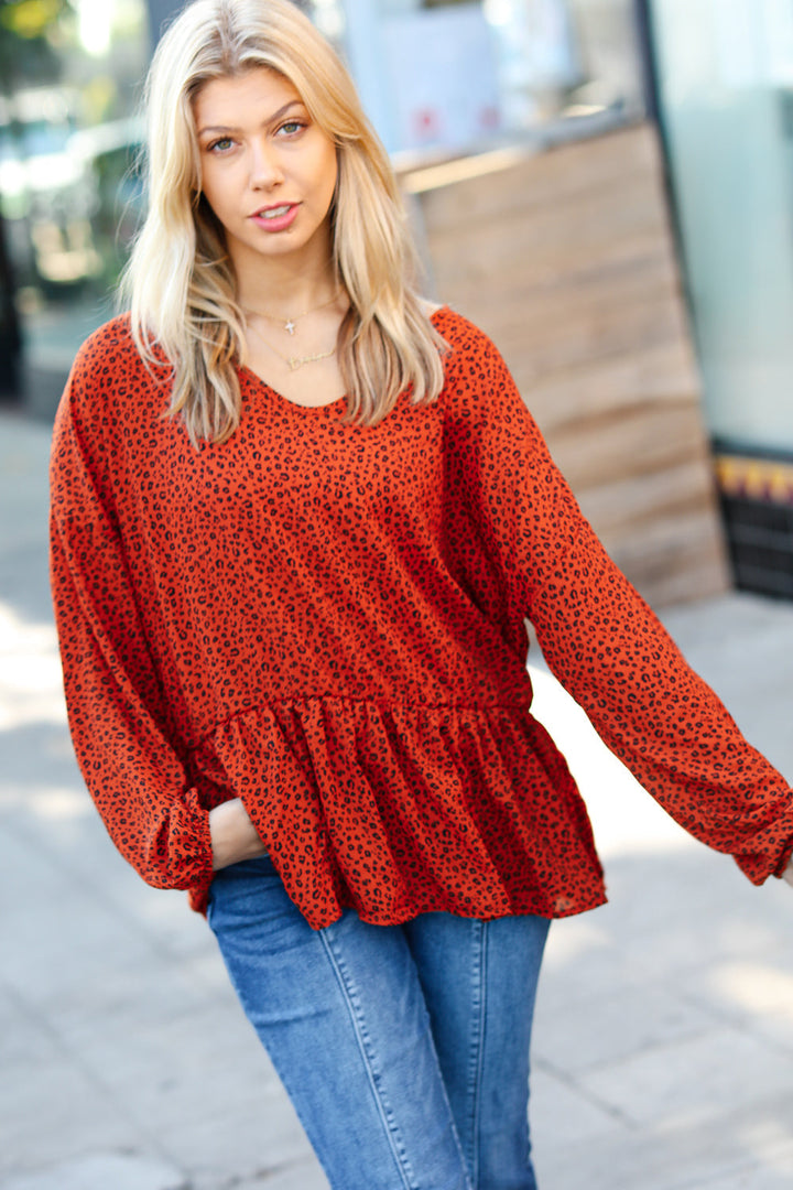 Feeling Bold Rust Leopard Print V Neck Peplum Top